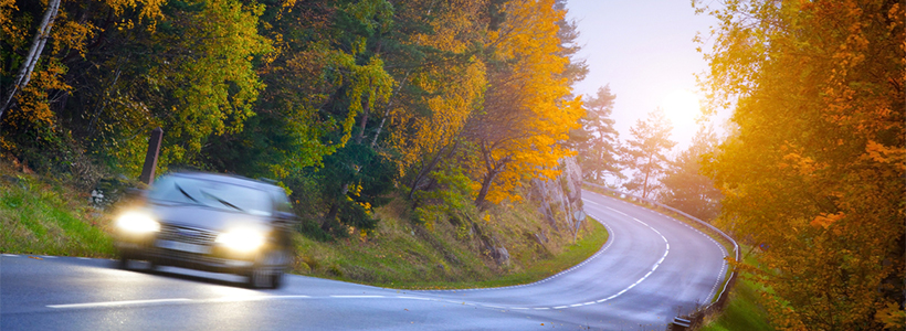 Car moving down country road safely