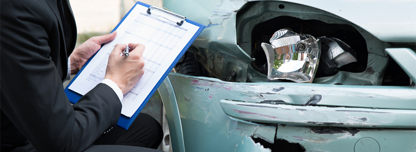 checking damaged car