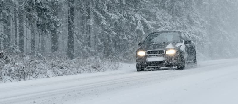 Car driving in snow