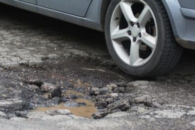 Car driving over tarmac