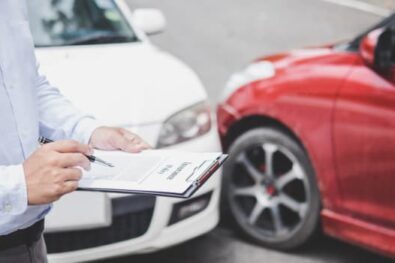 Man reviews insurance after car accident