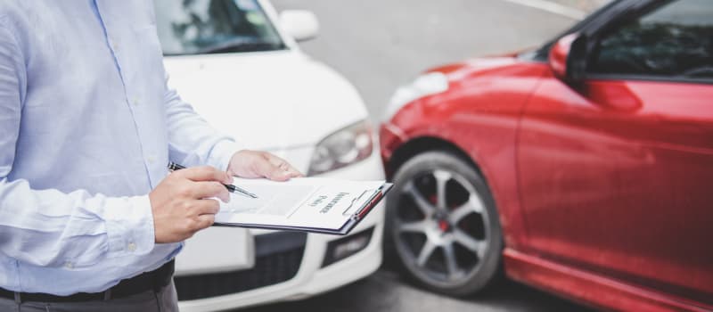 Man reviews insurance after car accident