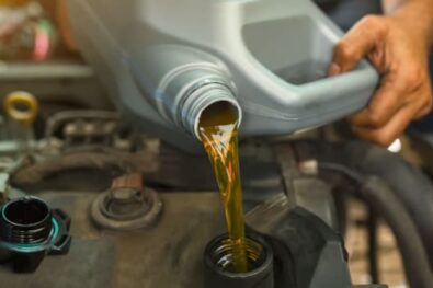 Mechanic changing motor oil