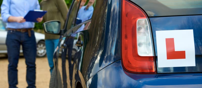 Learner talking to driving instructor